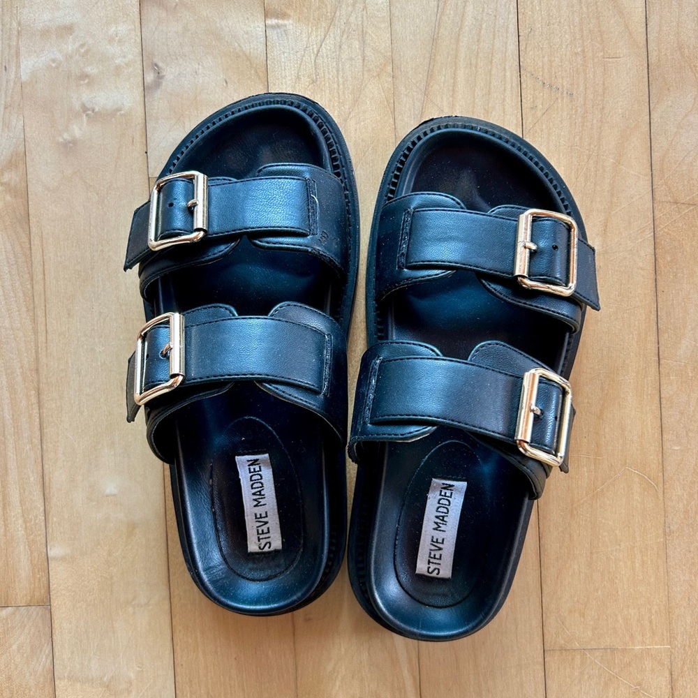 Black Steve Madden Slip-On Sandals with Golden Buckles